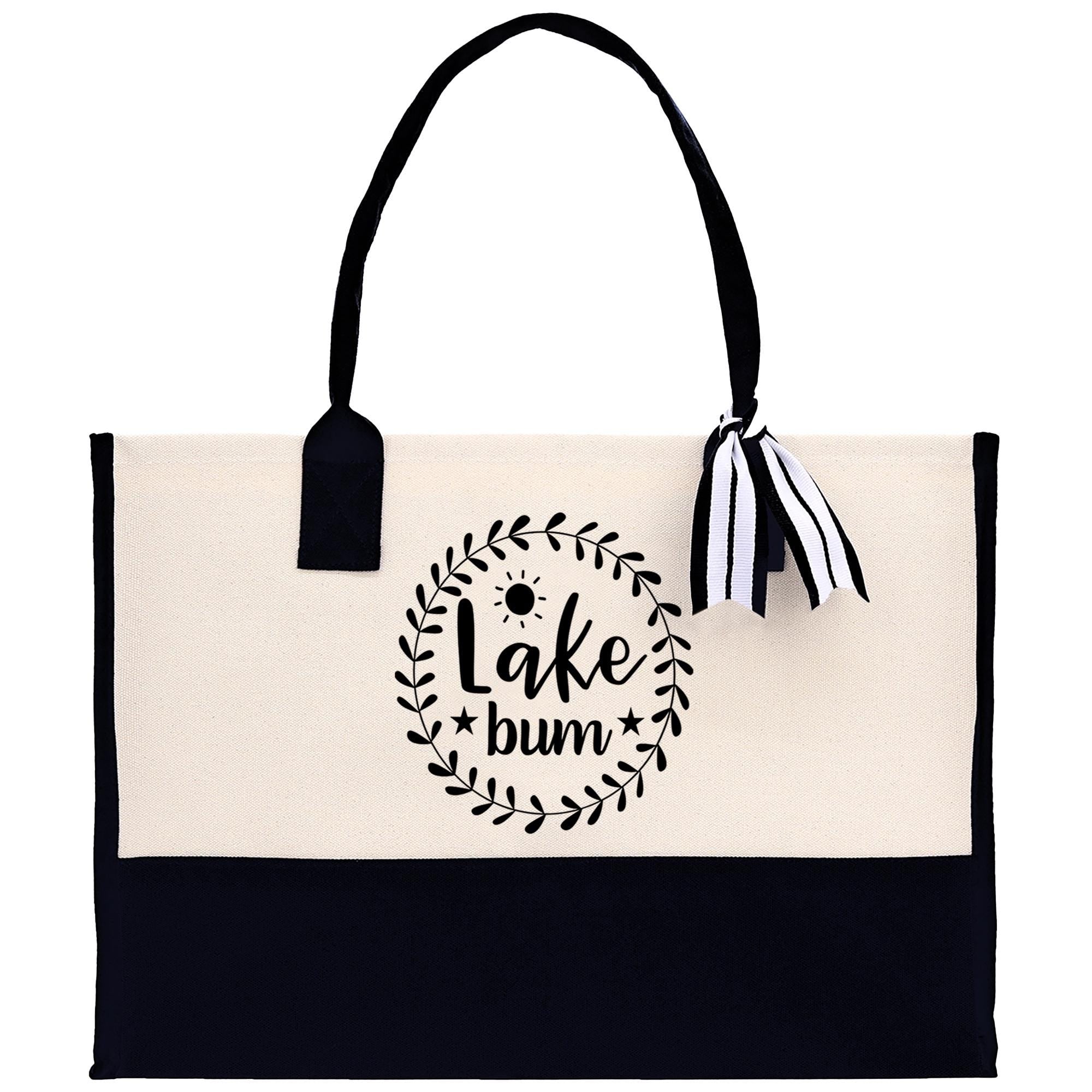 A black and white tote bag with a printed design on the front.