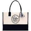 A black and white tote bag with a printed design on the front.