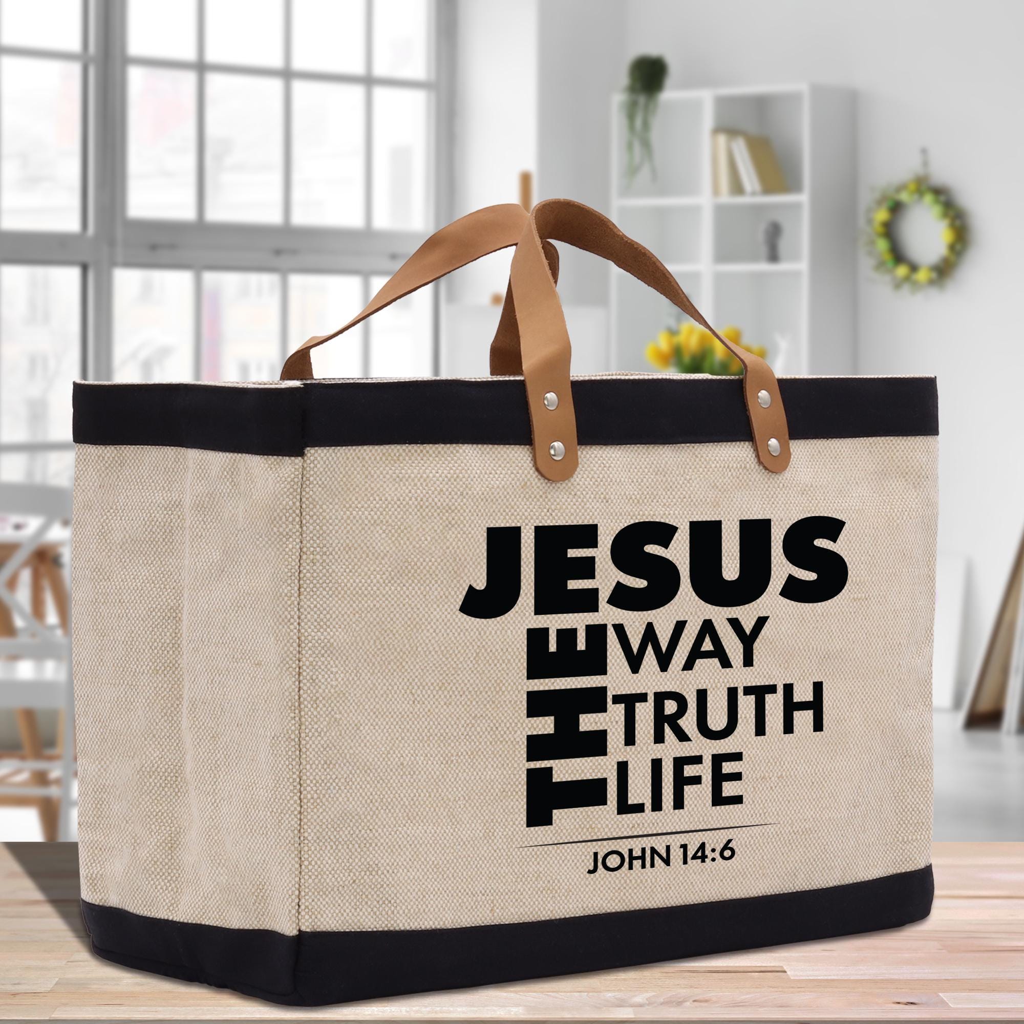 a canvas bag with a leather handle on a table