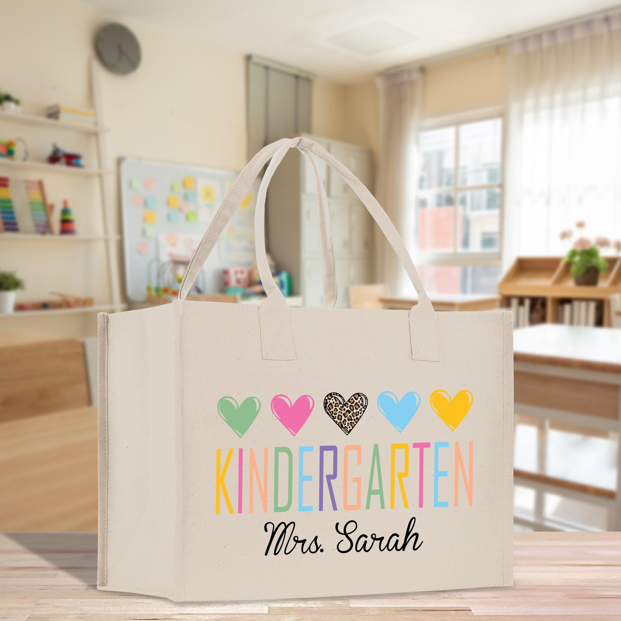 a white bag with colorful hearts on it sitting on a table