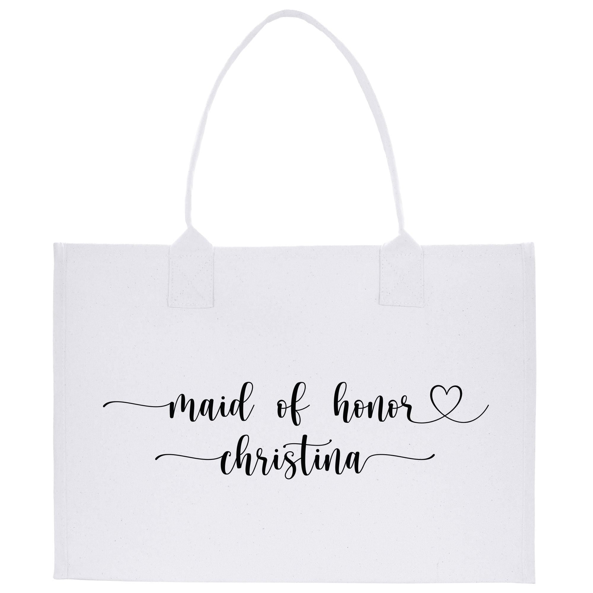 a white shopping bag with the words maid of hover and christmas written on it