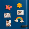a blue refrigerator door with various colorful magnets and photos attached to it.