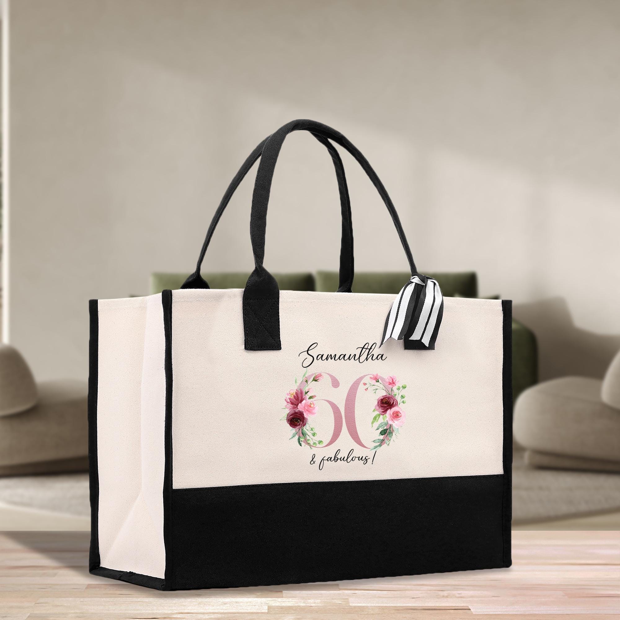 a black and white bag with a flower design