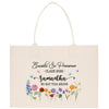 The image is a tote bag with a floral design and text printed on it.