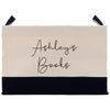a black and white bag with a name on it