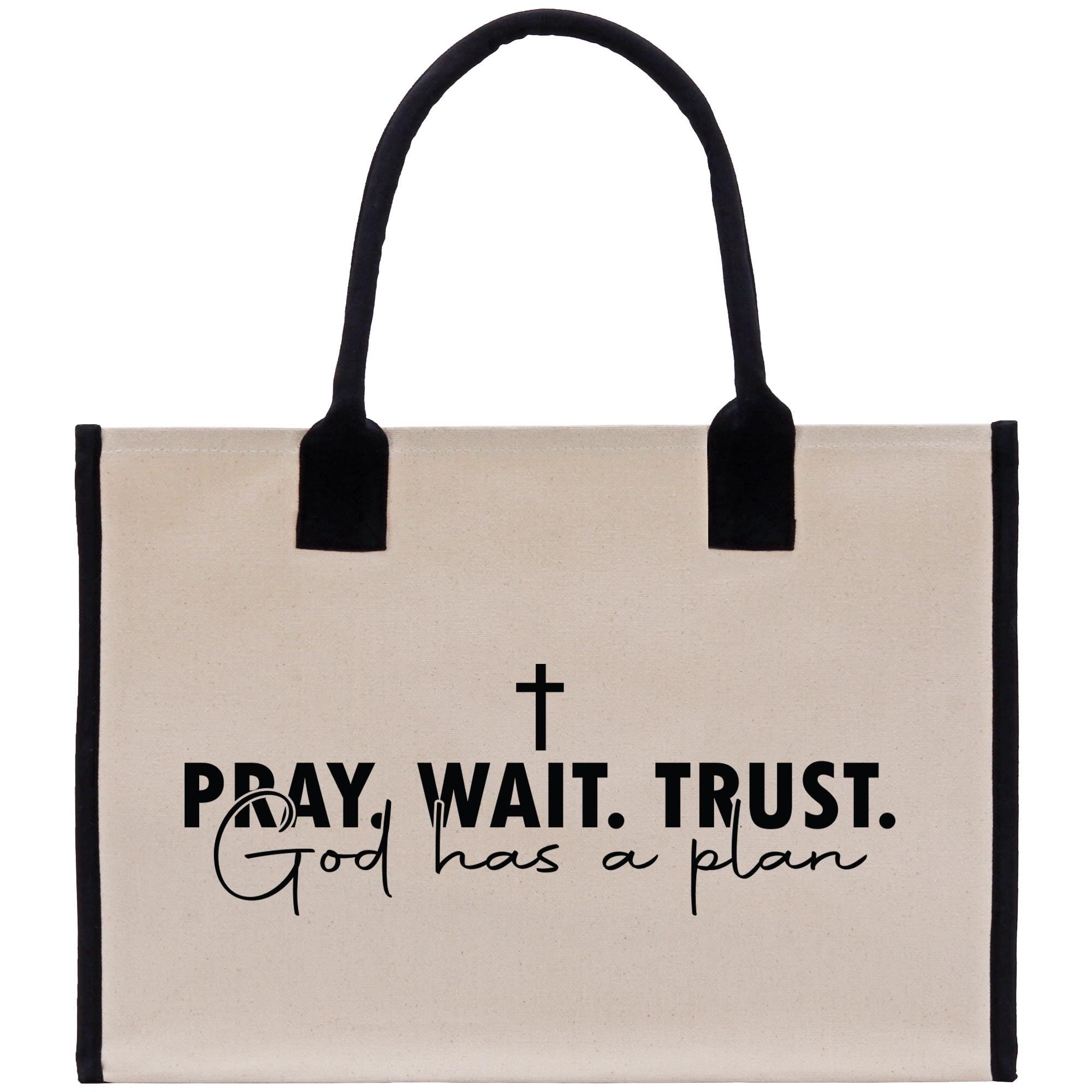 a bag with a cross on it that says pray wait trust god has a plan