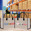 two shopping bags sitting on a table in a warehouse