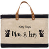 a black and white bag with a cat on it