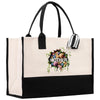 a black and white tote bag with flowers on it