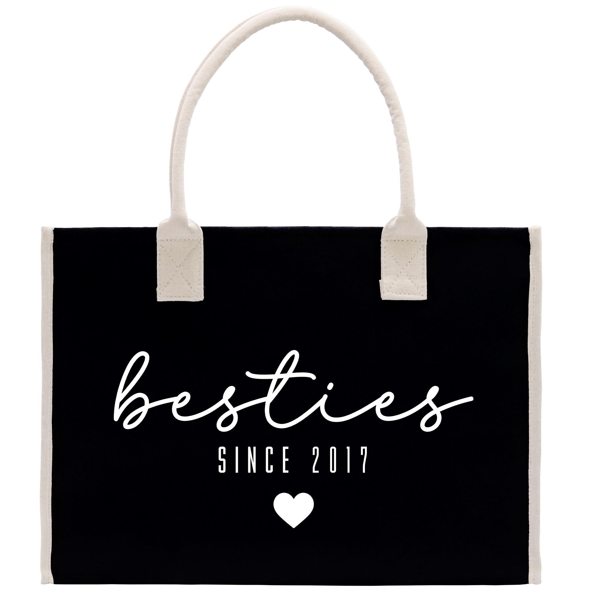 A black tote bag with white text and a heart symbol, indicating &quot;Besties Since 2017&quot;.