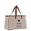 A beige canvas tote bag with brown straps and a heart symbol printed on it.