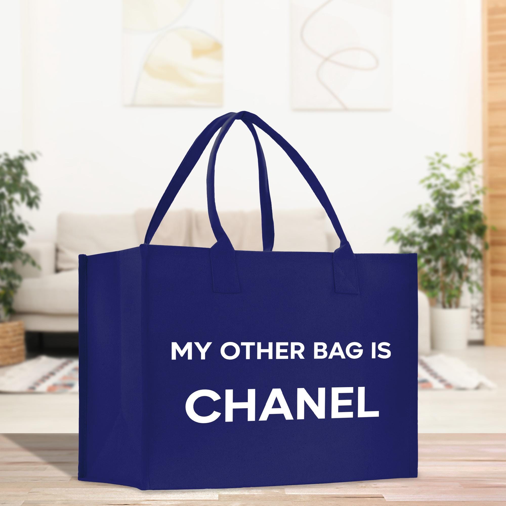 a blue bag that says, my other bag is chanel
