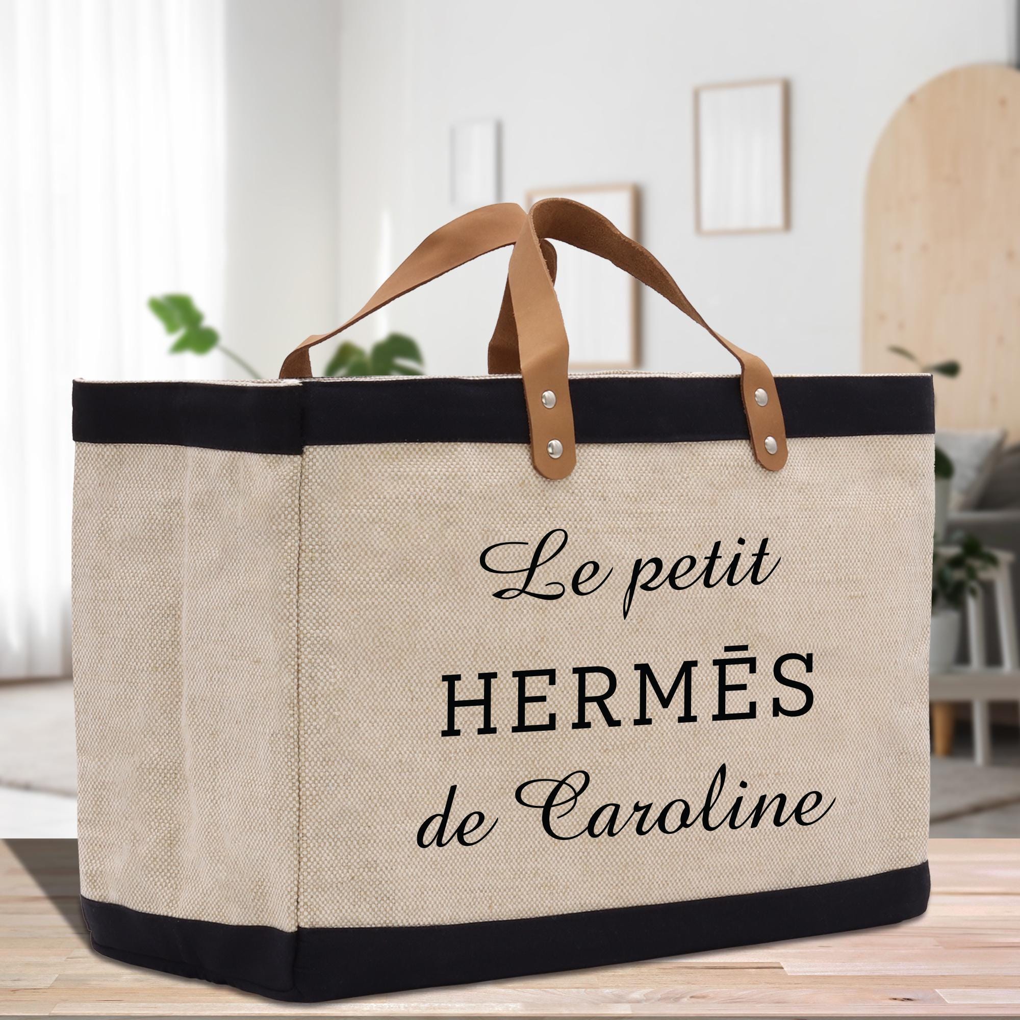 a canvas bag with leather handles on a table