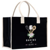 A black tote bag with a white handle and trim, featuring a graphic design of baking utensils and flowers.