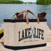 a lake life tote bag sitting on a dock