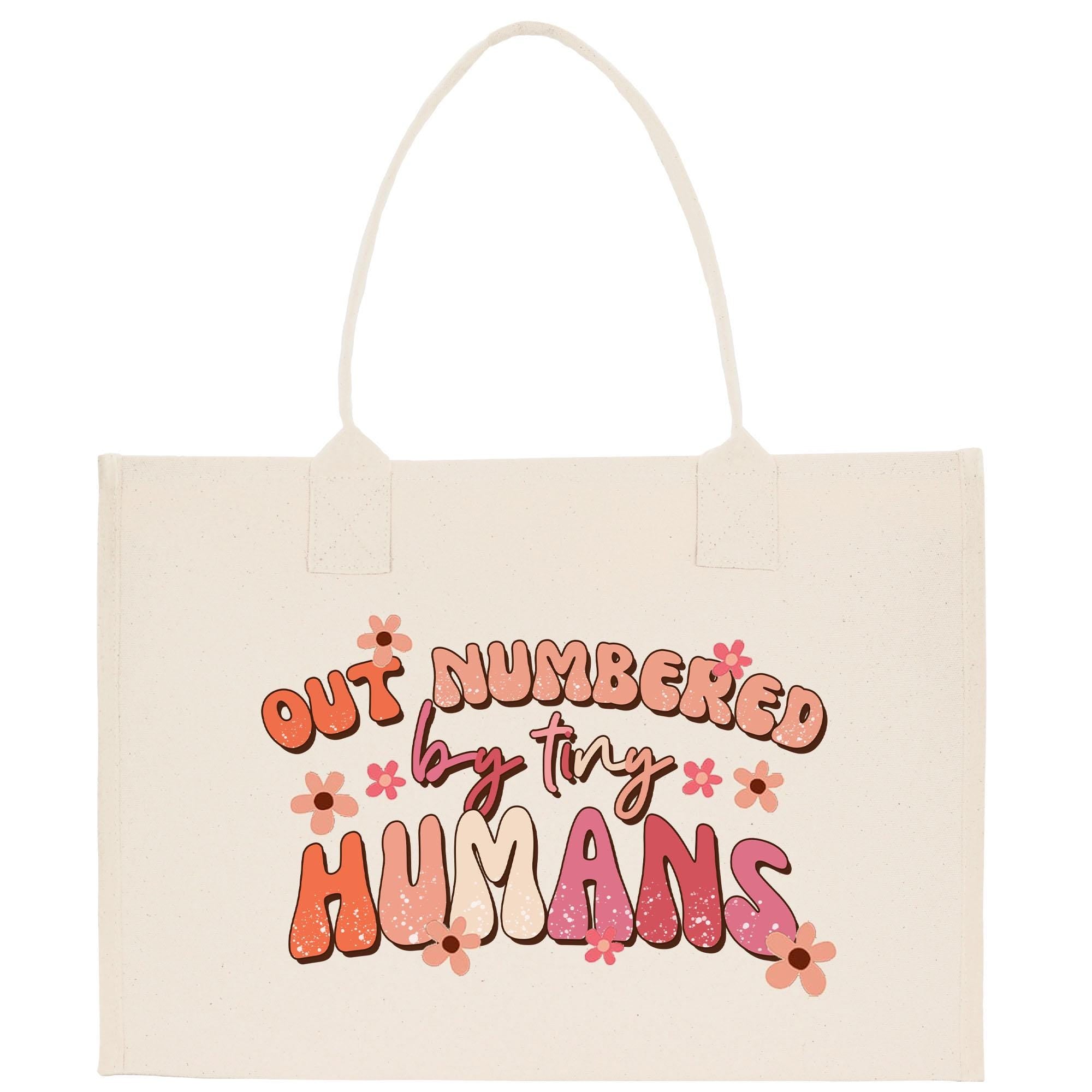 a white bag with the words out numbered by tiny humans