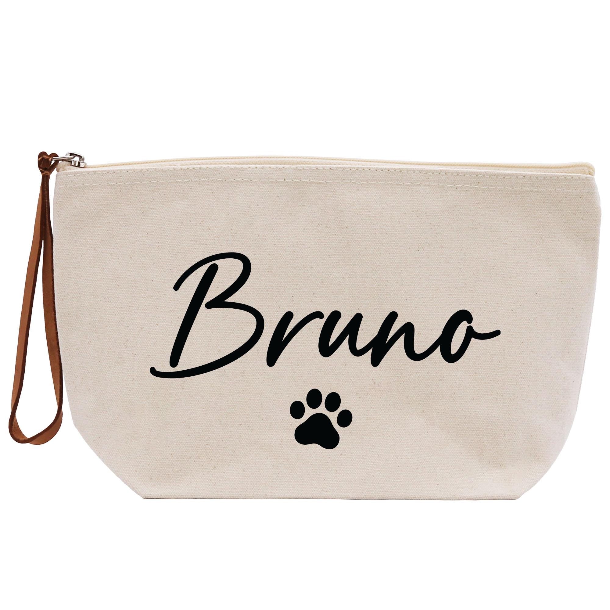 a white canvas bag with a dog&#39;s paw on it