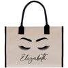 a canvas bag with eyelashes and the word elizabeth on it