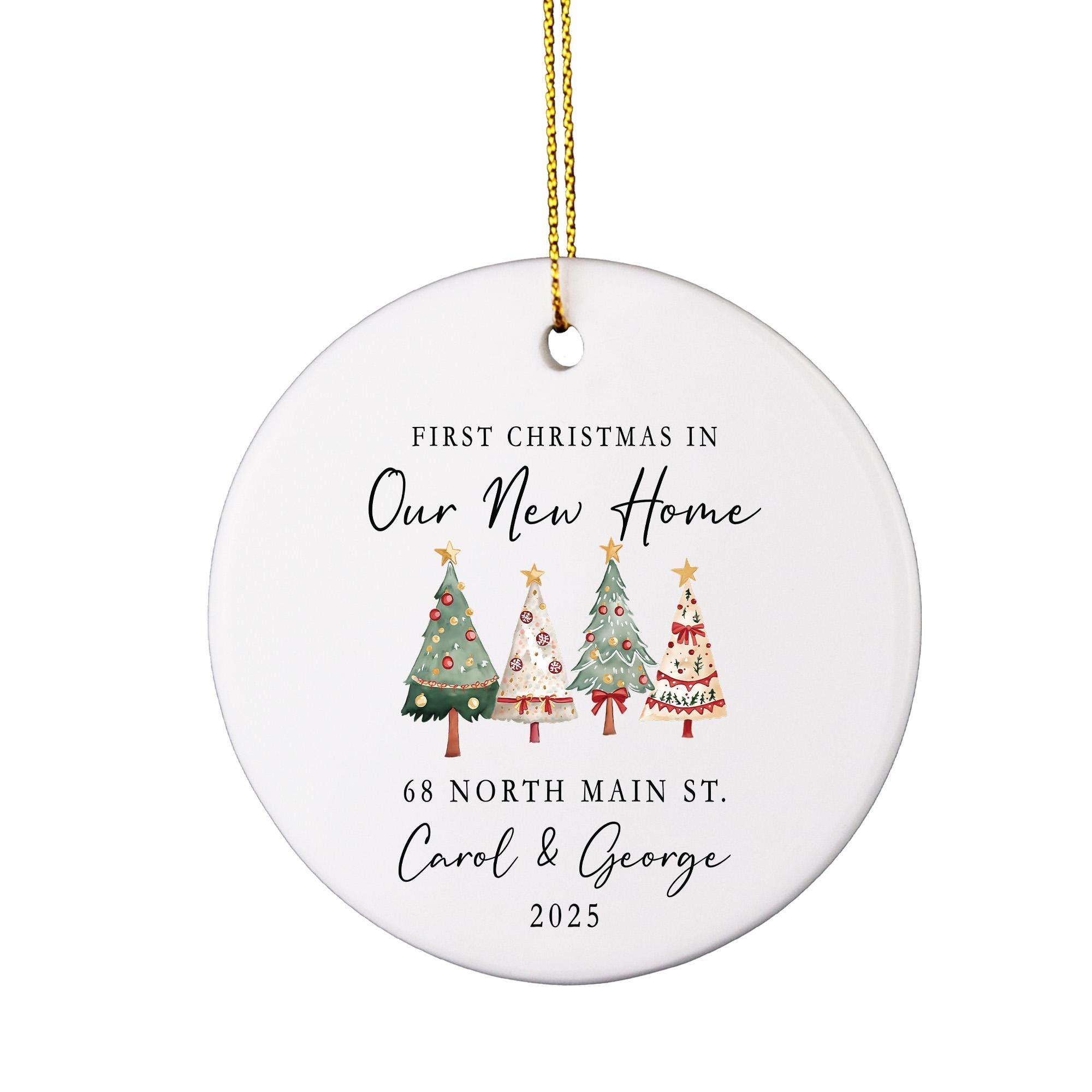 A white Christmas ornament with a gold chain hanging from it. The ornament features a festive design of four Christmas trees with ornaments and a ribbon. The text on the ornament reads &quot;First Christmas in Our New Home 68 North Main St. Carol & George 2015&quot;.