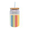 a jar of colored pencils with a straw sticking out of it