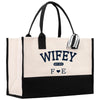 a white and black bag with a black handle
