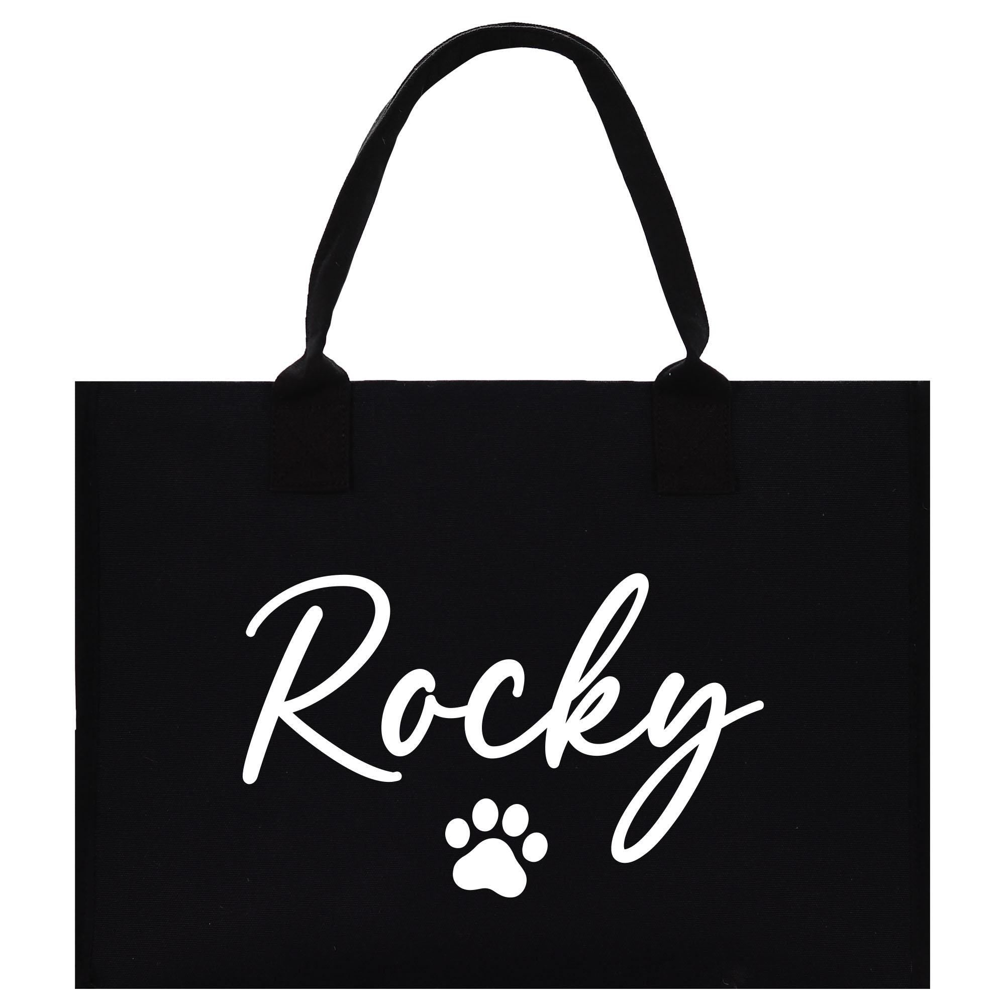 a black tote bag with a dog&#39;s paw on it