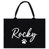 a black tote bag with a dog's paw on it