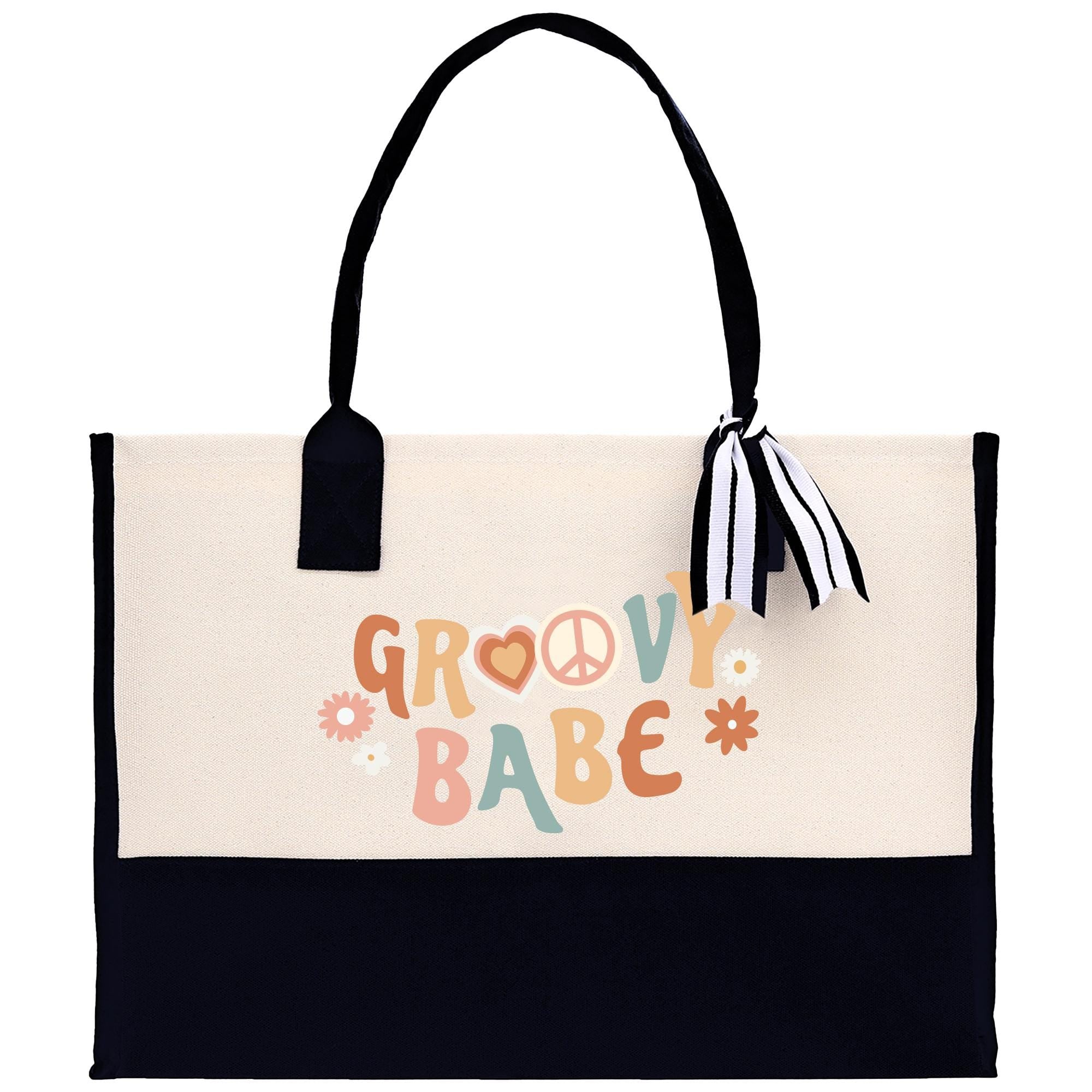 A beige tote bag with a black handle and a black and white striped ribbon tied around it. The bag has a printed design on it that says &quot;GROovy BABE&quot;.