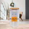 a glass jar with a straw inside of it