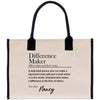 a beige tote bag with black handles and a definition of a " Difference Maker" printed on it.