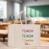 a white bag that says teach teach on it