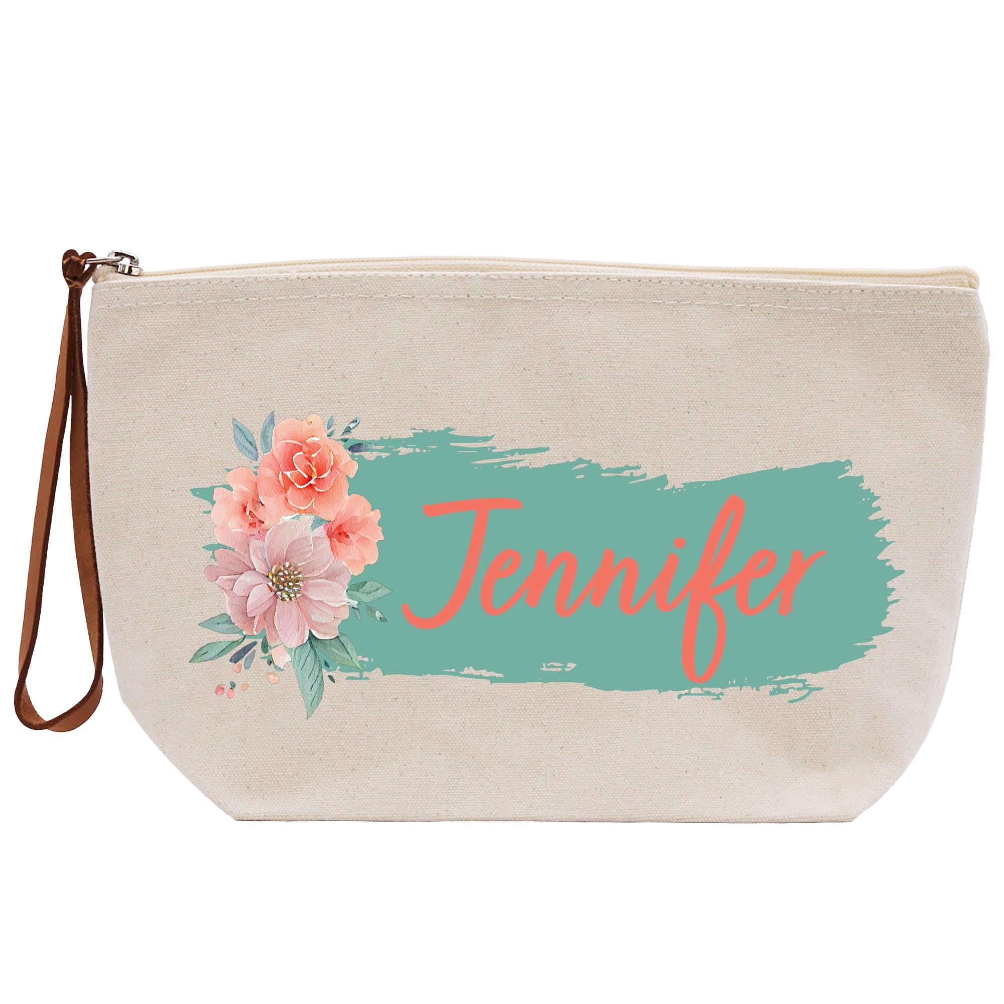 a canvas bag with a flower and name on it