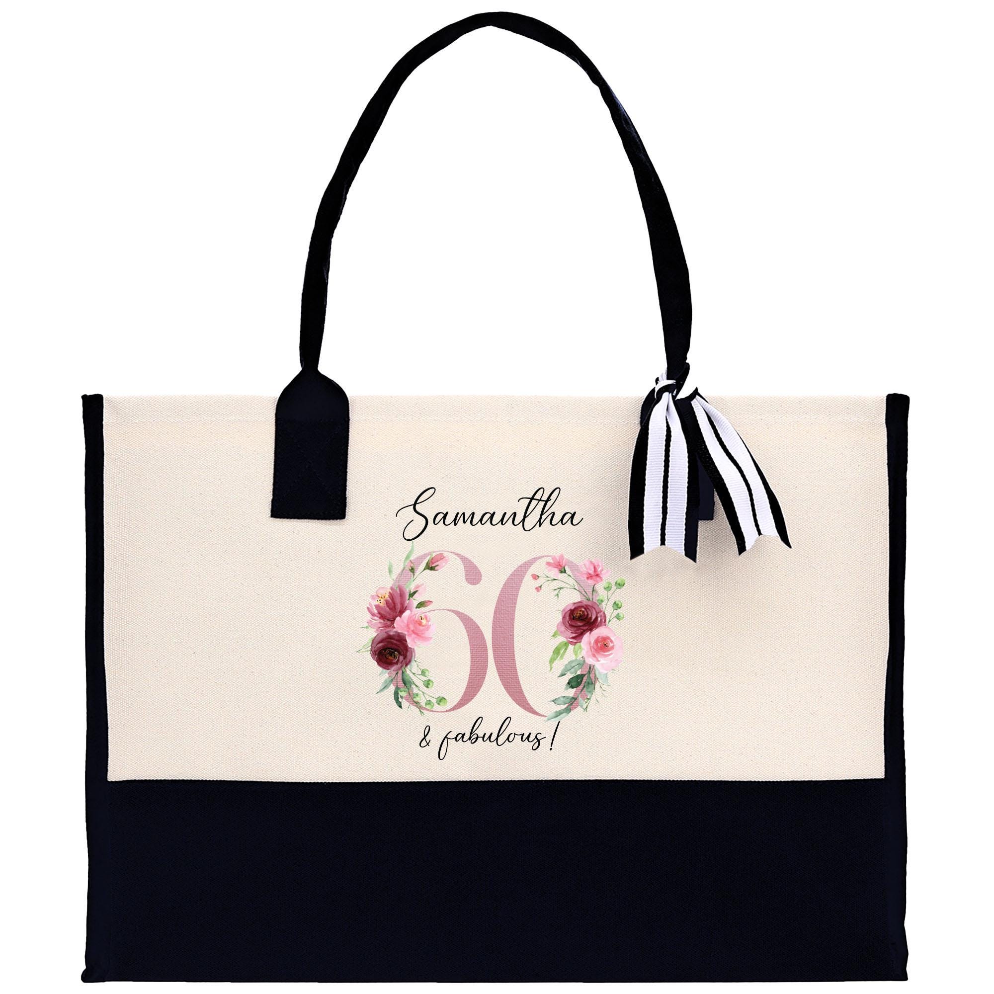 a black and white bag with a bow on it