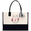 a black and white bag with a bow on it