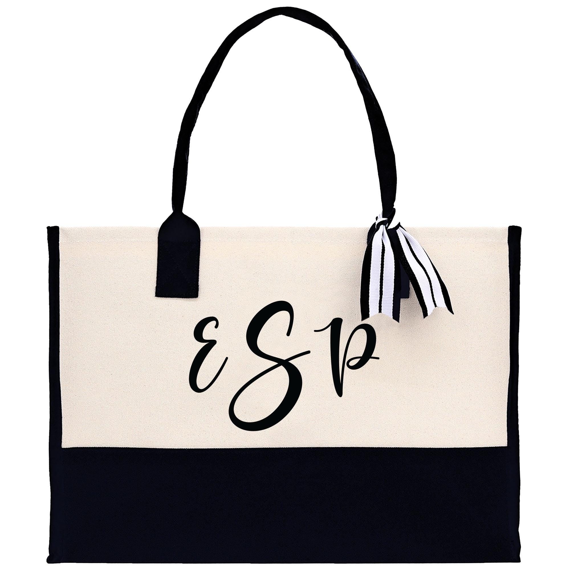 a black and white bag with a monogrammed logo