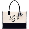 a black and white bag with a monogrammed logo