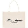 a white shopping bag with the word miss marina on it