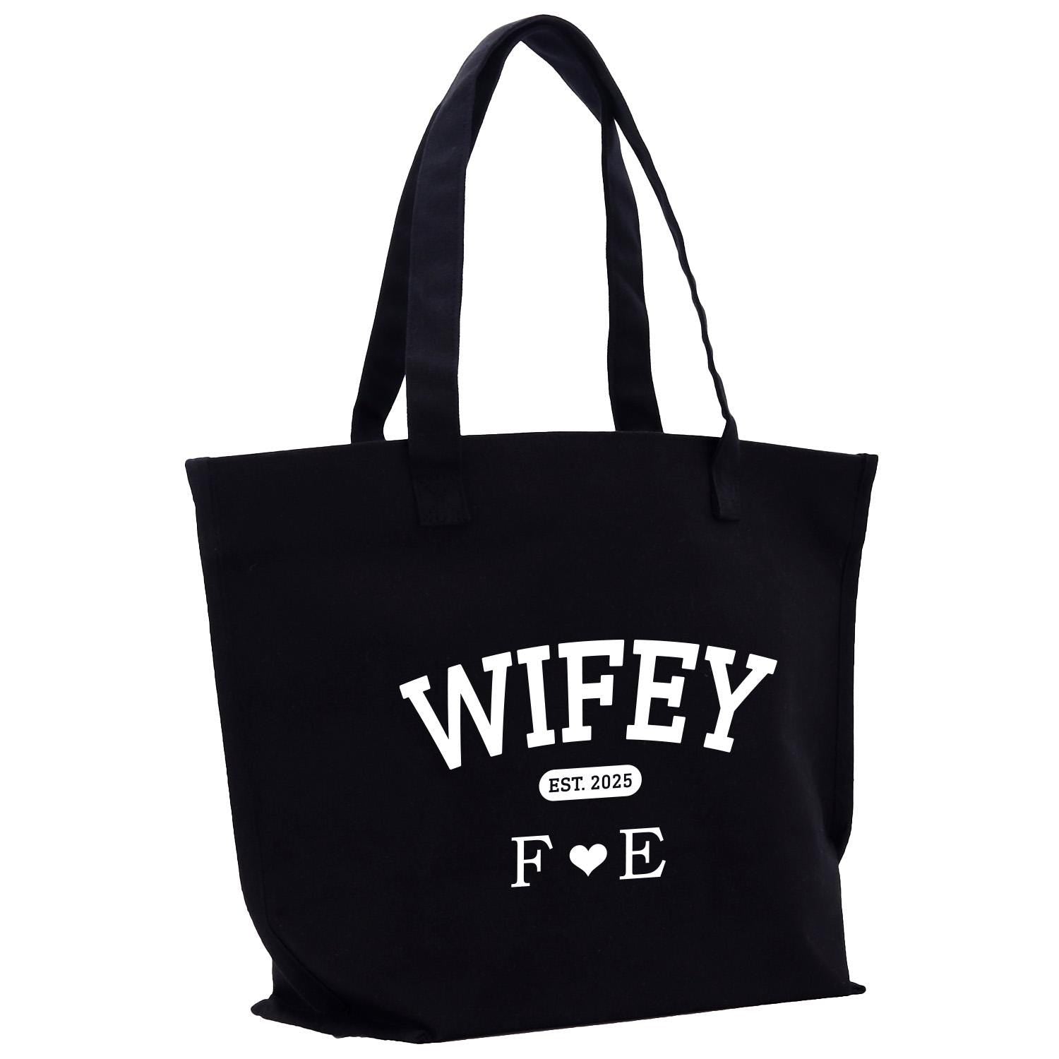 a black tote bag with white writing on it