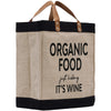 A beige tote bag with black trim and leather handles, featuring the text "ORGANIC FOOD just kicking IT'S WINE" printed on it.