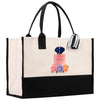 A large tote bag with a black and white color scheme, featuring a printed image of a perfume bottle and colorful flowers.