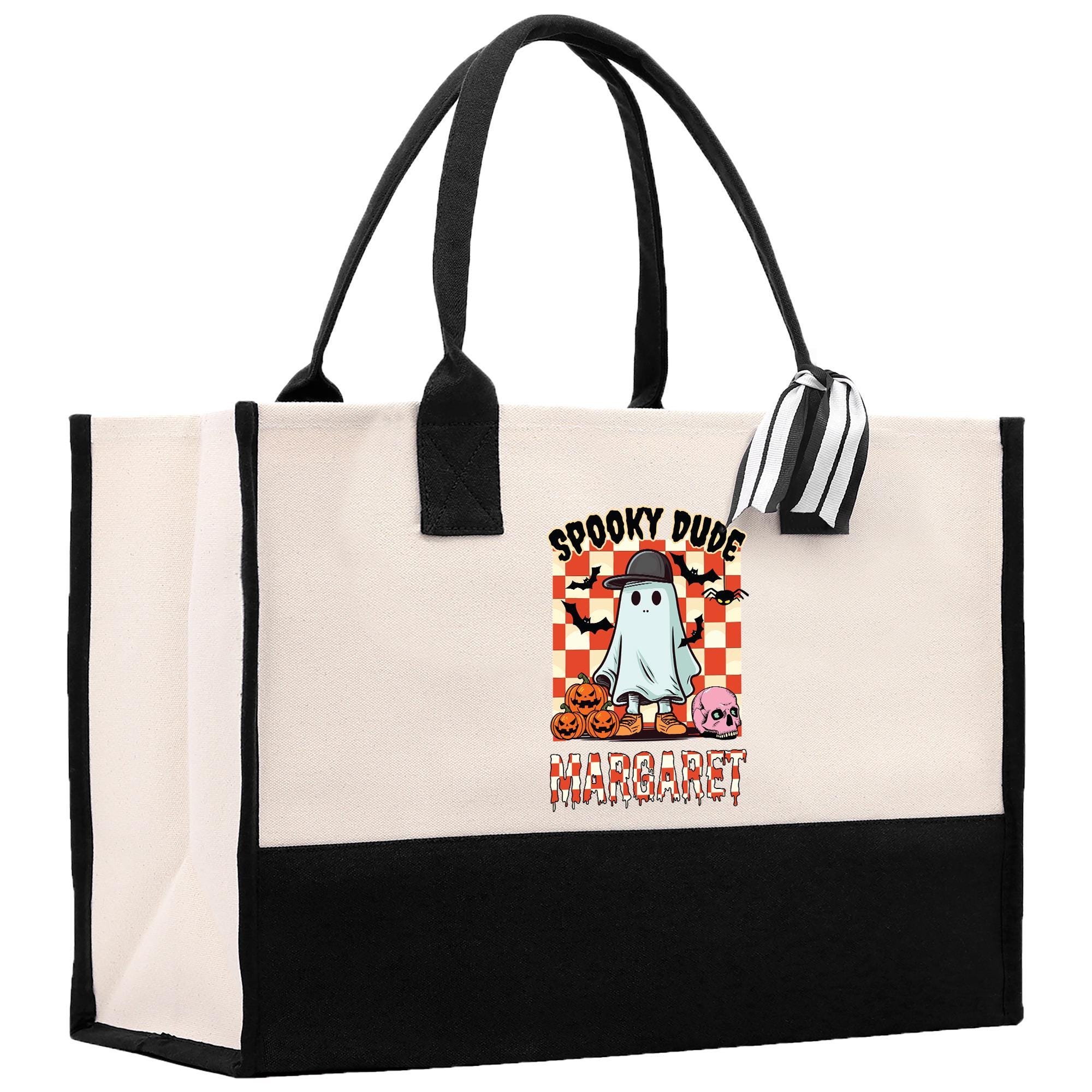 a black and white bag with a ghost on it