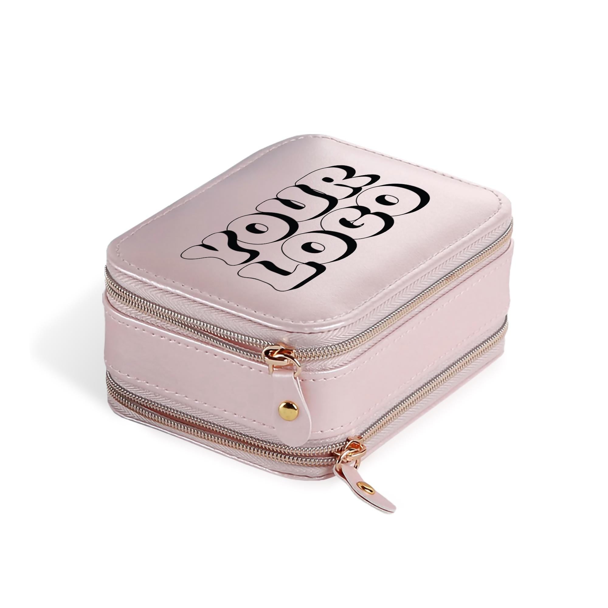 A pink makeup case with a zipper closure and a logo printed on it.