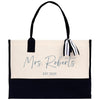 a black and white tote bag with a name on it