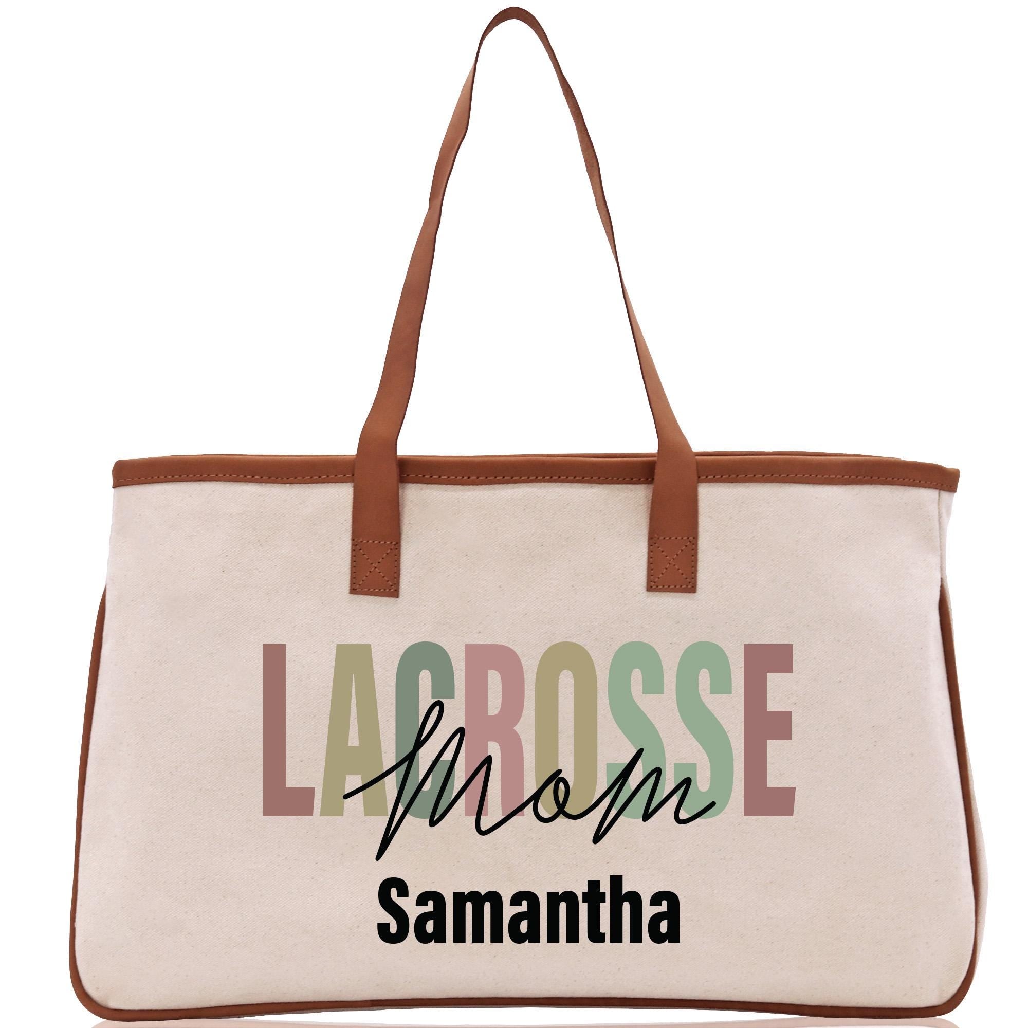 a white bag with a brown leather handle