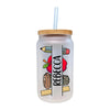 a glass jar with a straw in it