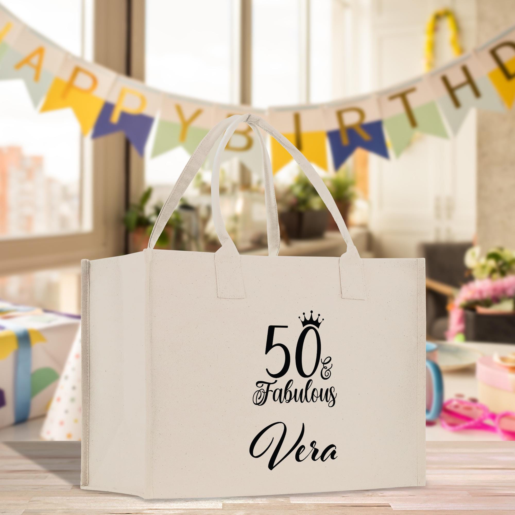 a 50th birthday gift bag sitting on a table