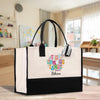 A large tote bag with a colorful, personalized design featuring the name "Rebecca" and the phrase "Little girls are better" printed on it.