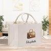 a white bag with a brown purse on it