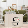 a bag with a flower on it sitting on a table
