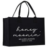 a black shopping bag with the words honey moon printed on it